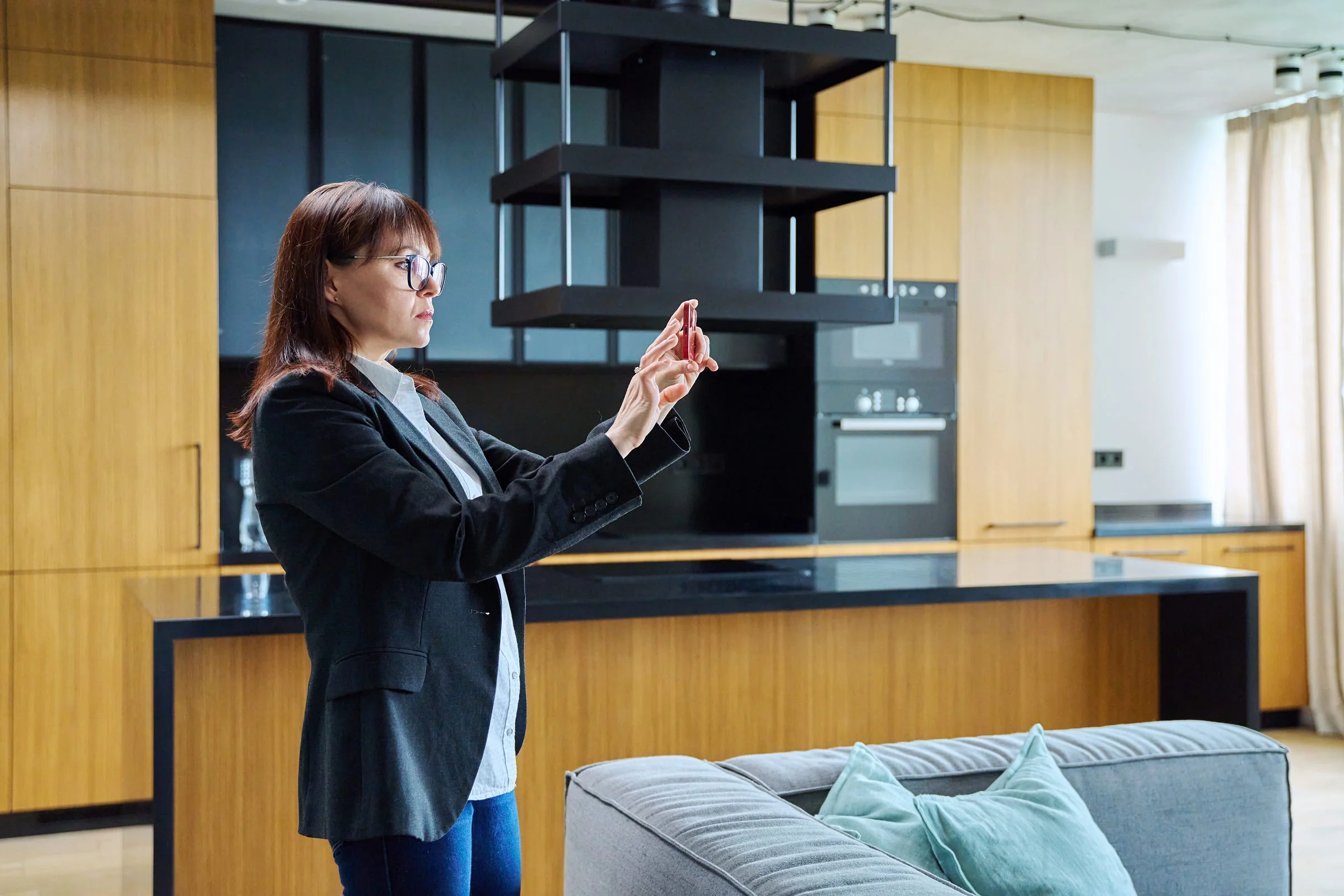 Commercial real estate professional reviewing property video on a tablet